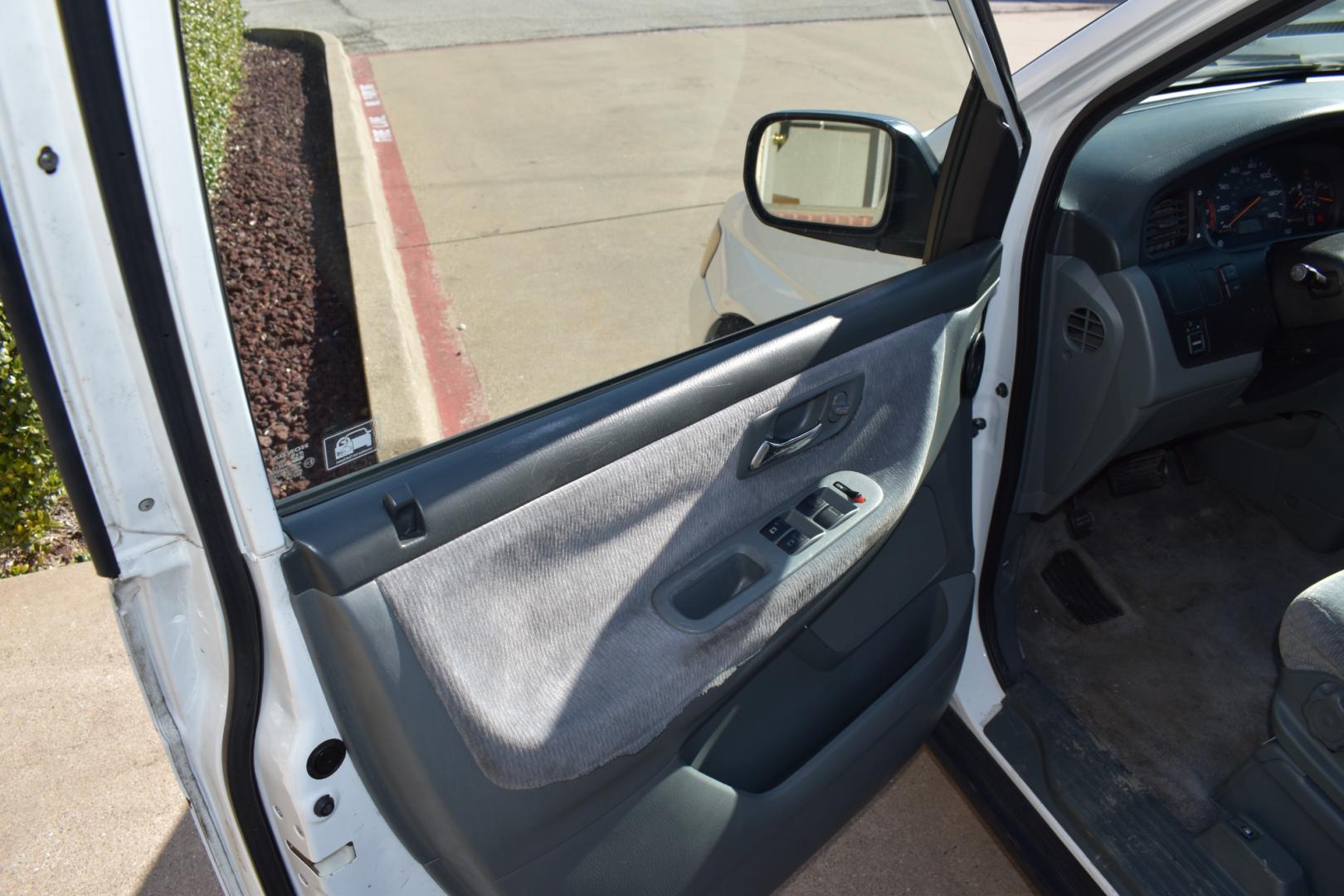 2003 White /Gray Honda Odyssey (5FNRL18513B) , located at 5925 E. BELKNAP ST., HALTOM CITY, TX, 76117, (817) 834-4222, 32.803799, -97.259003 - Buying a 2003 Honda Odyssey can be a smart choice for several reasons: Reliability: Hondas are known for their reliability, and the Odyssey is no exception. The 2003 model year is often praised for its durability and long-lasting performance. Safety: The 2003 Honda Odyssey comes equipped with safe - Photo#6